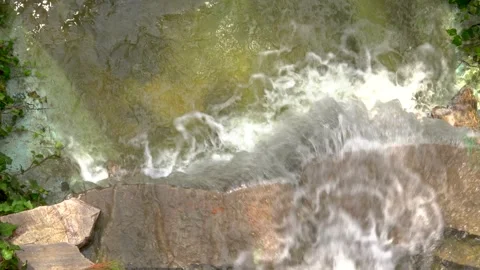 River flowing on a rocky texture Stock Footage 161079550