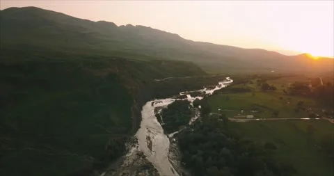 The river flowing at sunset Stock Footage 173438576