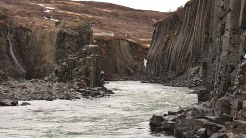 River flowing through basalt formations in Iceland Stock Footage 338202215