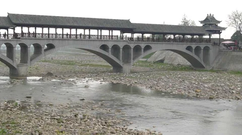 River flowing through a big stone arch bridge, Qionglai, Chengdu, Sichuan, China Stock Footage 36856087