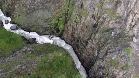 River flowing through cliffs and a gorge in the Caucasus Mountains, Georgia.  Stock Footage 130654299
