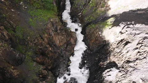 River flowing through cliffs and a gorge in the Caucasus Mountains, Georgia.  Stock Footage 130654307