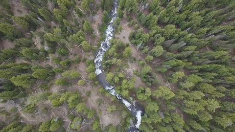 River flowing through forest, aerial. Beautiful fall river with rocks and trees. Stock Footage 129350493