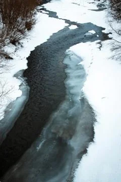 River flowing through ice Stock Photos
