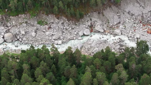 River is flowing through a mountain valley surrounded by a forest Stock Footage 289652670