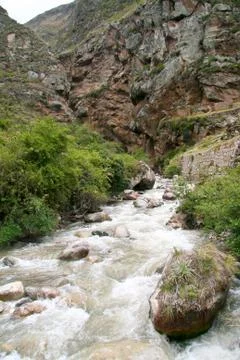 River flowing through the mountains in Cusco, Peru. Stock Photos
