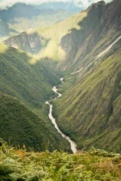 River flowing through the mountains in Cusco, Peru. Stock Photos