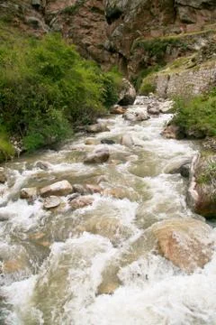 River flowing through the mountains in Cusco, Peru. Stock Photos