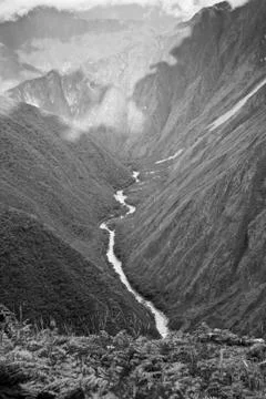River flowing through the mountains in Cusco, Peru. Stock Photos