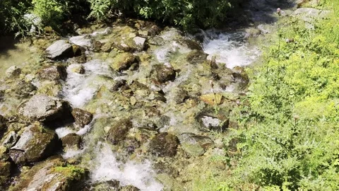 River flowing through the mountains Stock Footage 341269213