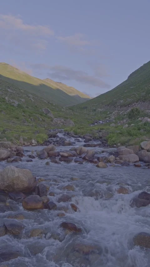 A river flowing through the mountains, vertical 4K landscape Stock Footage 280341486