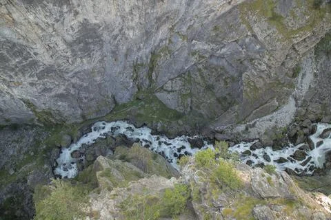 River flowing through narrow mountain canyon gorge Stock Photos