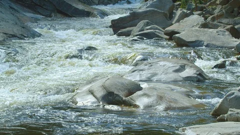 River flowing through rocks Stock Footage 103824610