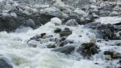River flowing through the rocks on mountain Stock Footage 77450789