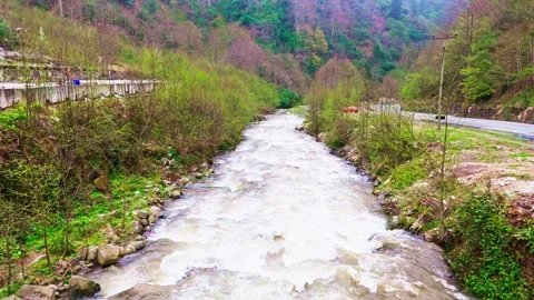 A river flowing through a small town Stock Footage 272792958