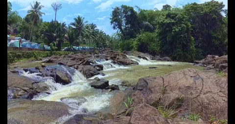 River Flowing Through Tropical Rocks in Indonesia Stock Footage 317804809