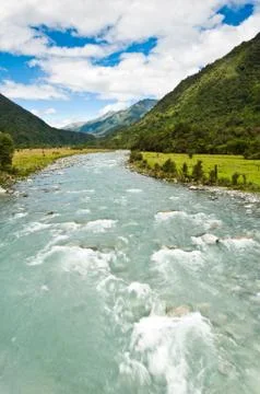 River flowing through a valley Stock Photos