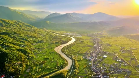  River Flowing Through Wide Mountain Valley Stock Footage 322829021