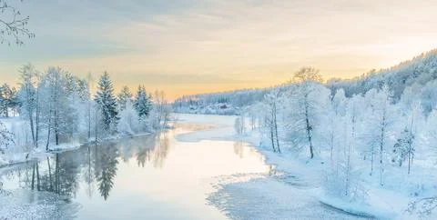 River flowing through the winter forest in Sweden Stock Photos