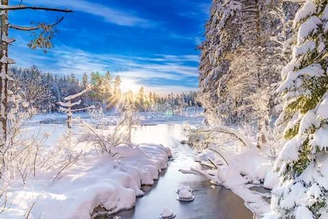 River flowing through the winter forest in Sweden Stock Photos