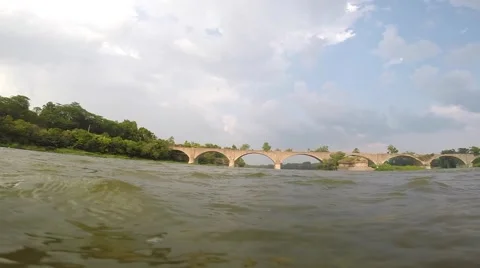 River Flowing towards abandoned interurban bridge with slow pan Stock Footage 40650139