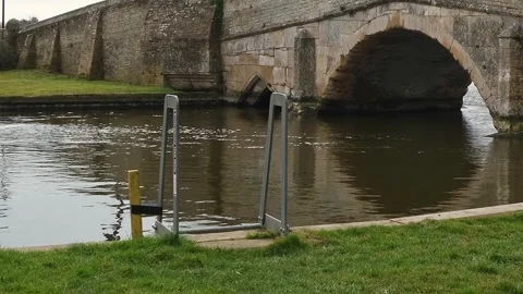 River flowing under the ancient Potter Heigham bridge, Norfolk Broads Stock-Footage 305336741