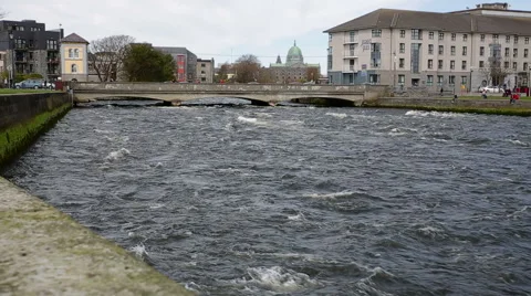 River flowing under busy bridge in Galway, Ireland Stock Footage 44525565