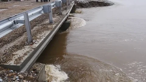 River flowing under the damaged bridge Stock Footage 73949064
