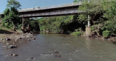 The river flowingunder the bridge Stock Footage 165653935