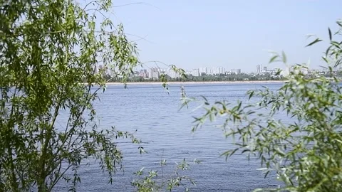 River flows against the background of the city Stock Footage 223687612