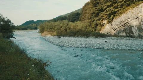 The river flows along the cliffs Stock Footage 95242978