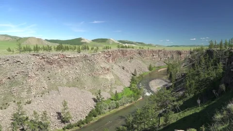 River flows along a deeply incised rocky valley - Slope Failure and Rock Debris Vídeos de archivo 339701812