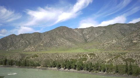 The river flows among the mountain scenery Video stock 118314788