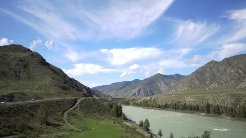 The river flows among the mountain scenery Stock Footage 119203875