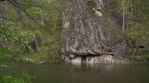 The river flows among the mountain scenery Video stock 234332588