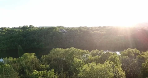 River flows between forests. Spring forest, reflection in water Stock Footage 90830334