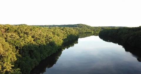 River flows between forests. Spring forest, reflection in water Stock Footage 90832794