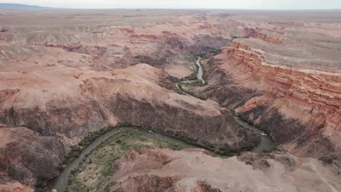 River flows in canyon among mountains, red rocks. Aerial view Stock Footage 219945727