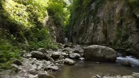 River flows in the cracks of rocky cliffs Video stock 257743187