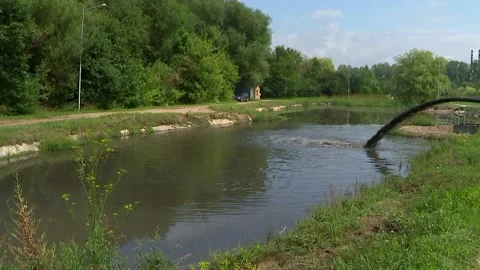In the river flows dirty water, pollutes the environment Video stock 92552348
