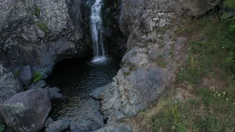 The river flows down through rocky terrain 1 Stock-Footage 331382526