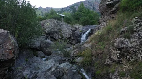 The river flows down through rocky terrain 3 Video stock 331382594