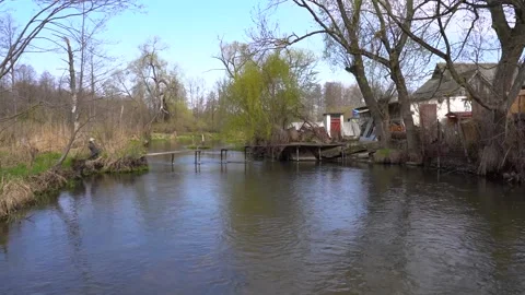The river flows near a private house Stock Footage 154908631