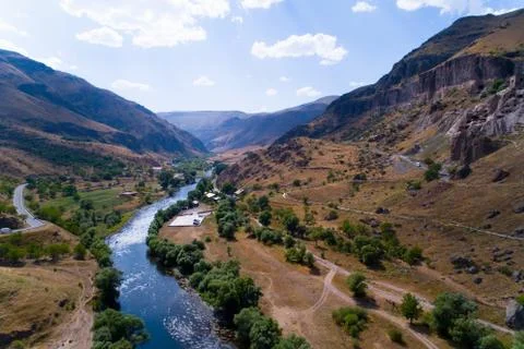 The river flows next to the cave city of Vardzia. Stock Photos