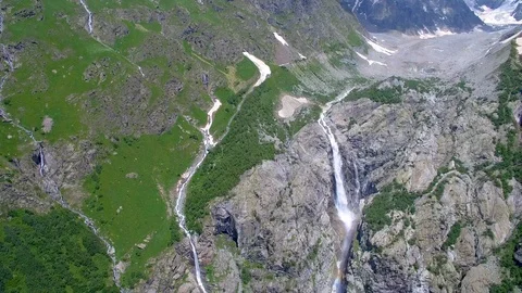 River flows out of the glacier from the mountain Stock-Footage 94596068