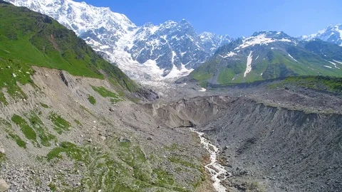 River flows out of the Shkhara Glacier aerial view 스톡 동영상 94584038