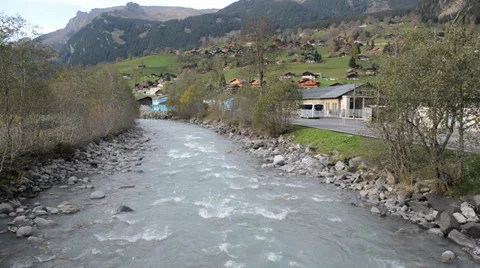 River flows over rocks in this beautiful scene in the swiss Alps Stock Footage 33782326