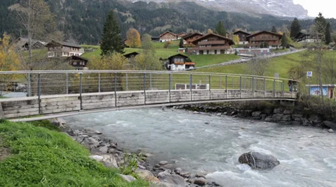 River flows over rocks in this beautiful scene in the swiss Alps Video stock 33782497