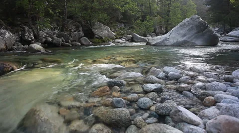 A river flows over rocks in beautiful scene in spring mountains Stock Footage 39465730