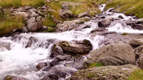 A river flows over rocks in this beautiful scene Stock Footage 41514824
